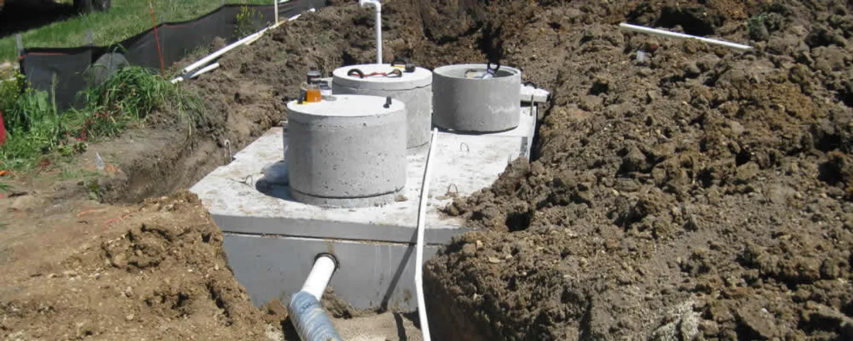 Septic system repair and installation site with tank access ports in Greenville, NC